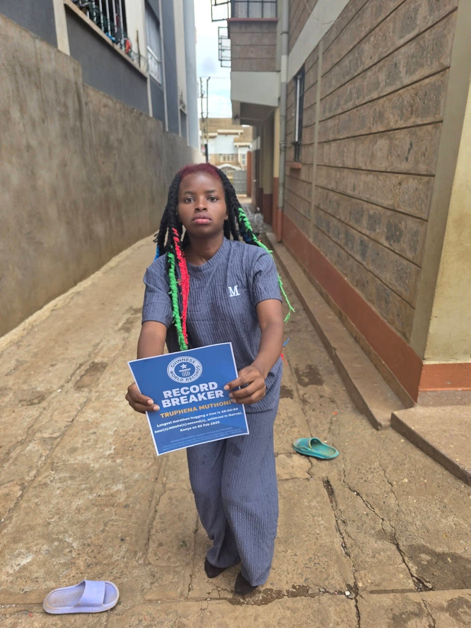 Environmentalist Truphena Muthoni Receives Guinness World Records Badge for 48-Hour Tree-Hugging Feat